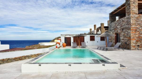 Stone villa with a sea water swimming pool and a sea and sunset view